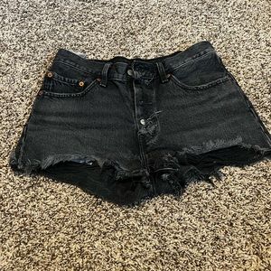 Levi 501 black jean shorts with button up design